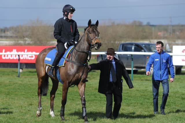 THE FAVOURITE -- champion jockey Tony McCoy on Shutthefrontdoor after a pre-Grand National workout at Southwell a couple of weeks ago (PHOTO BY: Anna Gowthorpe/PA Wire).