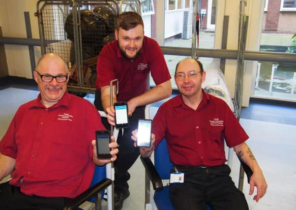 Porters David Riley, Sam Coulson, and David Farre swith the new technology