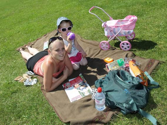 Samantha Butcher, and Layla Dickinson, aged three, enjoying the sunshine in Endcliffe Park