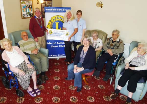 Isle of Axholme Lions presentation at Greenacres residential home, Crowle. President Graham Guest is pictured with activities co-ordinator Pat Boyle and carer Vicki Knight.