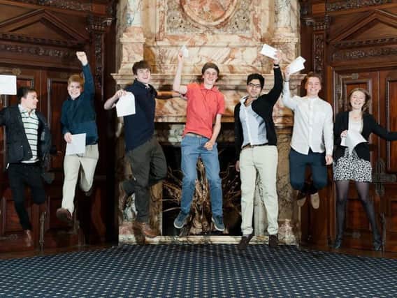 A-level students from Worth School in West Sussex celebrate their exam success in August 2014. Photo: Emma Duggan Photography