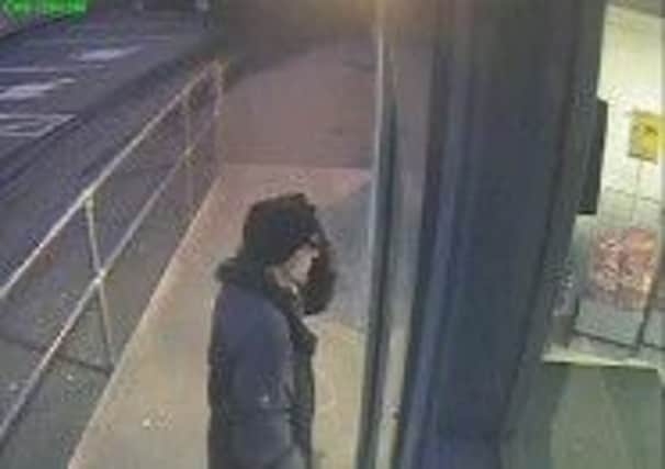 CCTV of a man police are tracing in connection with an armed robbery.