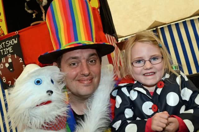 Mr Magic pictured with Lowri Smith, five, of Epworth.
