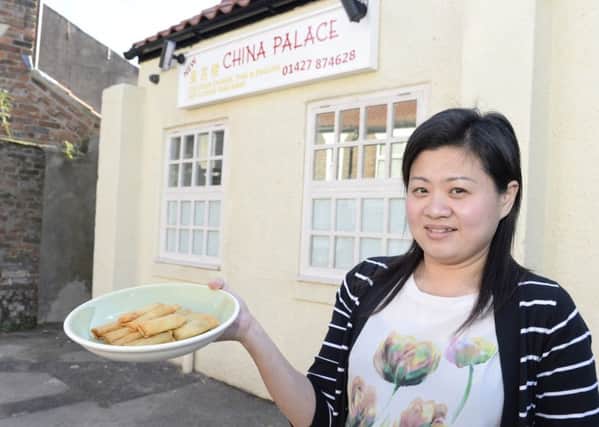 Epworth Bells Reader offer. Vivian Xue with some of the free spring rolls from China Palace.