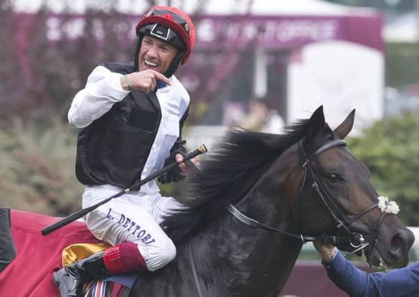 ARC HEROES -- Frankie Dettori on Golden Horn, winner of the 2015 Qatar Prix de l'Arc de Triomphe at Longchamp. (PHOTO BY: Michel Euler/AP Photo).