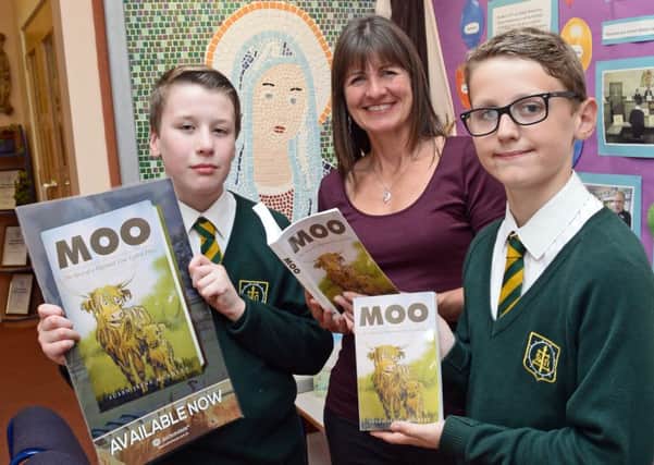 Author Susan McAuley, pictured with l-r Nicky Colebrook and Oscar Hill, both ten. Picture: Marie Caley NEPB McAuley MC 2