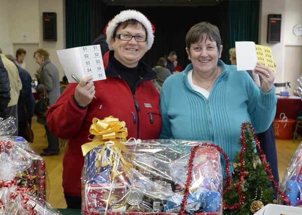 Linda Lawcock and Denise Edwards with raffle tickets at the Crowle Christmas Bazaar