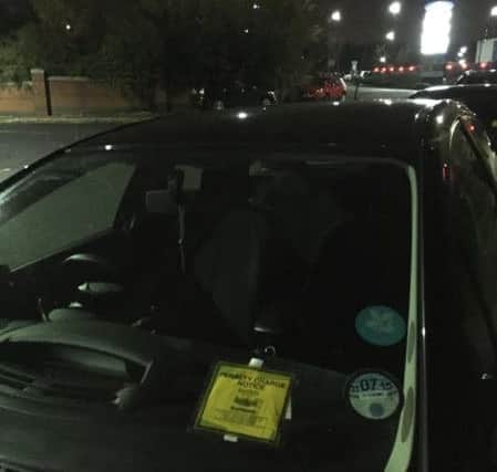 One of several cars with a fixed penalty notice parked on the pavement between Valley Centretainment and Meadowhall Retail Park during a One Direction gig at Sheffield Arena.