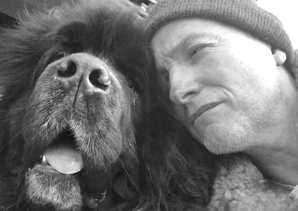 Simon Brian Cartlidge and his dog Shakespeare. He has written a book