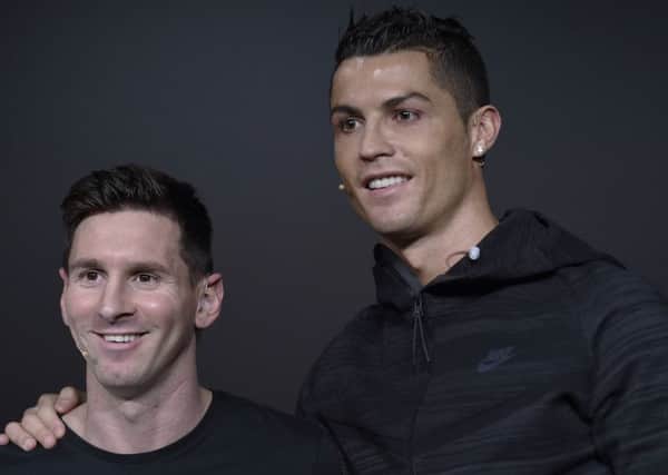 Argentina's Lionel Messi and Portugal's Cristiano Ronaldo, two of the nominees for the FIFA Ballon d'Or 2015 award, attend a press conference prior to the ceremony in Switzerland