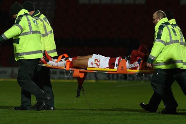 Cameron Stewart is strechered off after falling on his neck