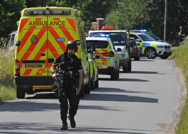 Armed police on The Cove, Westwoodside were there are reports of an armed person on the loose. Picture: Andrew Roe
