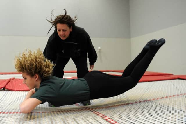 Neve Hillson with teacher Nicola Talbot, of Netherwood School during a trampolining session. Picture: Andrew Roe