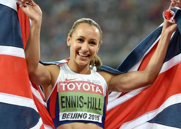 Great Britain's Jessica Ennis-Hill celebrates after winning gold in the Women's Heptathlon after winning the 800m, during day two of the IAAF World Championships at the Beijing National Stadium, China.  Photo credit:  Martin Rickett/PA Wire.