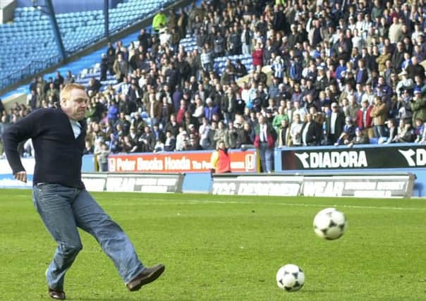 Actor and Owls fan Tommy Craig takes part in a penalty shoot out competition at half time on Sunday at Hillsborough