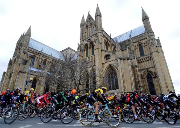 Stage 2 of The Tour De Yorkshire from Selby to York, 174KM, pictured Riders in the main peloton pass Beverley Minster.