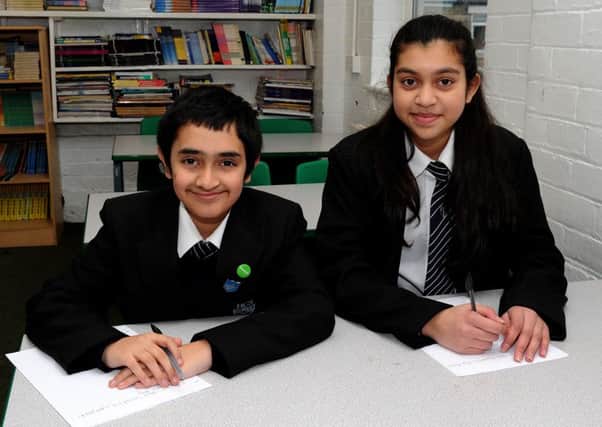 Ahmed Hussain and Riya Rajanah, of Handsworth Christian School,are regional finalists in the Royal Mail Young Leteer Writer of the Year competition