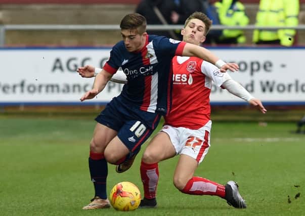 Doncaster's new boy Lynden Gooch fends off a challenge from Fleetwood's Nick Haughton