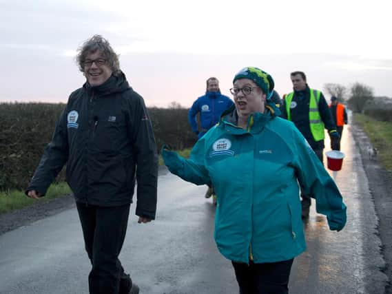 Comedian Jo Brand is set to arrive in Doncaster today as part of her 150 mile charity trek across the width of the country in aid of Sport Relief. She is pictured here on yesterday's leg of the challenge with fellow comedian, Alan Davies.