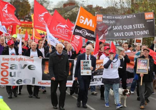 Steel workers and members of Unite and GMB march through Scunthorpe today November 10 2015 to protest over job losses at Tata Steel in the town. Over 100 people hit the street to show their solidarity with the steel workers effected by the cuts.