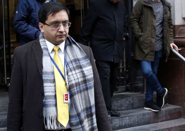 Previously unissued photo dated 18/1/2016 of Dr Farhan Husain Zaidi leaving the General Medical Council, in Manchester where he is facing allegations that his fitness to practise is impaired by reason of misconduct. PRESS ASSOCIATION Photo. Issue date: Tuesday January 19, 2016. The doctor made threats to refer various NHS Trusts to the Care Quality Commission regulator unless "a decent six-figure sum" was made to him, the disciplinary panel has heard. Dr Zaidi was said to have made "serious allegations" against a number of individual Trusts throughout the country, claiming that they had been dishonest and deceitful as well as making allegations of race and religious discrimination. See PA story GMC Zaidi. Photo credit should read: Peter Byrne/PA Wire