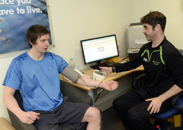 Doncaster Free Press reporter Paul Goodwin gets a health check / personal training session at Nuffield Health Fitness and Wellbeing. Pictured with Jon Wright