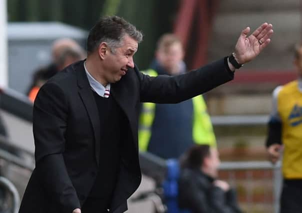 Darren Ferguson shouts instructions to his players.  Picture: Howard Roe