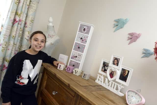 Paris Mullholland in her newly decorated bedroom in Doncaster