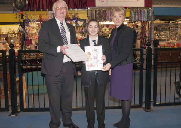Crowle teenager Jade receives prize for her market meerkat creation