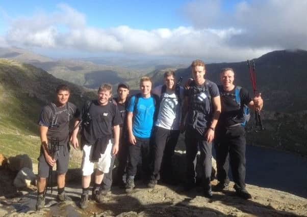 Darren Fitzpatrick and colleagues walk Hadrian's Wall for charity.
