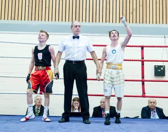 Tom Hill ABC's Conner Kelsall has his hand raised after victory in the England Boxing Youth Championships