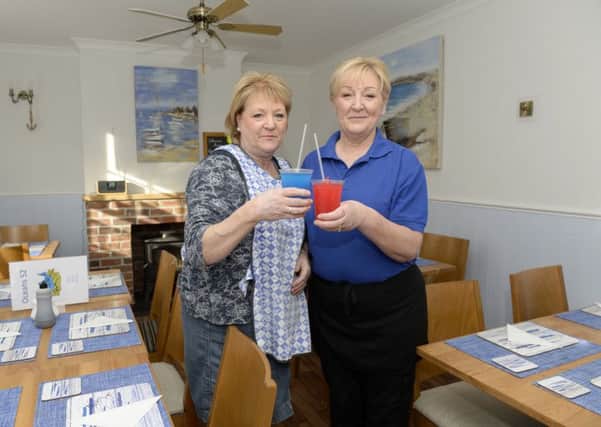 Epworth Bells reader offer of a free cup of iced slush at Oceans 52. Jeanette McConachie and Julie Wasley