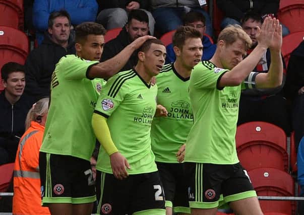 Sheffield United United's players celebrate Che Adams' winning goal. Photo: 

Andrew Roe