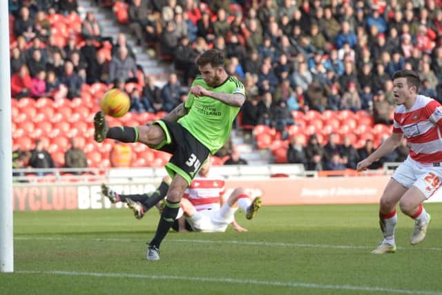 Andy Williams' header is cleared by David Edgar