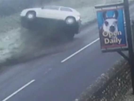 The car flipped over after skidding on an icy country lane