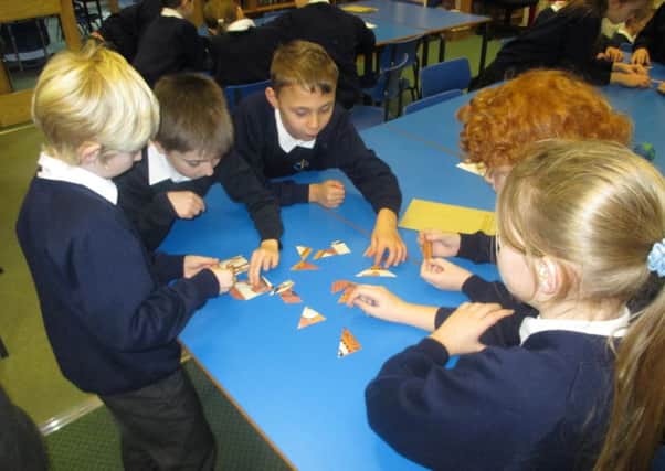 Pupils at West Butterwick Primary School identify Egyptian artefacts in school.