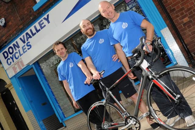 (l-r) Andrew Belk, Tony Batty, and Martin Maltby, of Don Valley Cycles are giving away a Giant Defy 5 bike as a prize. Picture: Andrew Roe