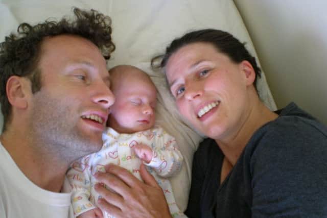 Lucy Atkinson with her husband and baby girl
