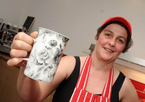 Caroline Walker, of Walker's Diner, Station Street, Swinton holds a cup of coffee which is on offer along with a mince pie. Picture: Andrew Roe