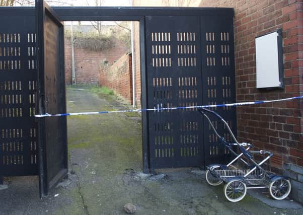 Police tape across the rear access of houses in Lister Avenue in Balby, Doncaster as they investigate a suspected rape 
Picture by Dean Atkins