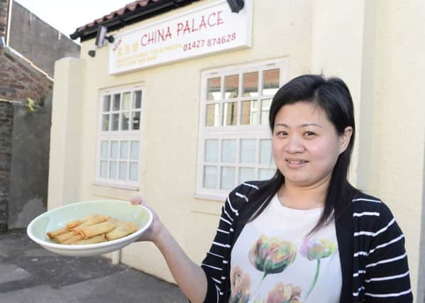 Epworth Bells Reader offer. Vivian Xue with some of the free spring rolls from China Palace.