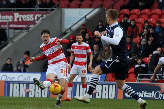 Doncaster's Conor Grant has a shot on goal