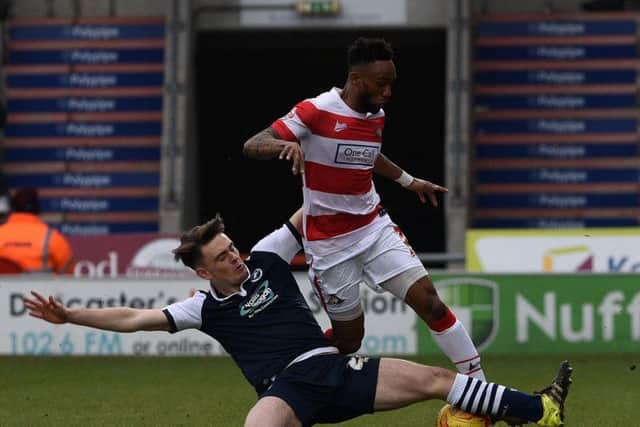 Cedric Evina cannot escape the attention of Millwall's Ben Thompson