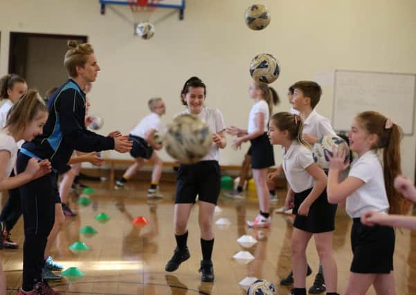 Belles striker Natasha Dowie was at Plover Primary School on Monday for the fifth round draw of the SSE Womens FA Cup.