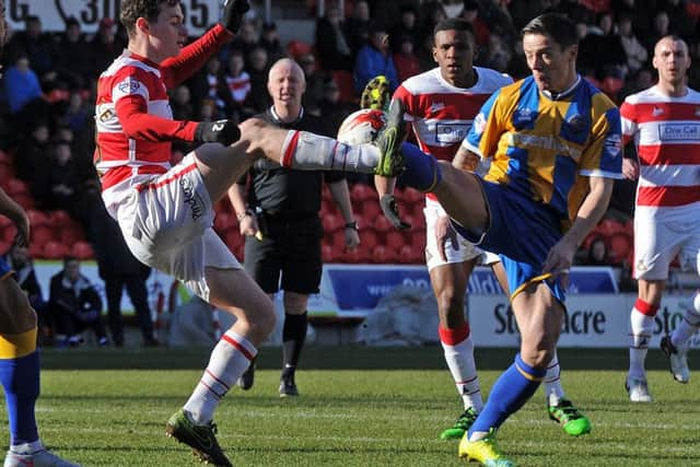 Doncaster's Liam Mandeville battles with Shrewsbury's Ian Black