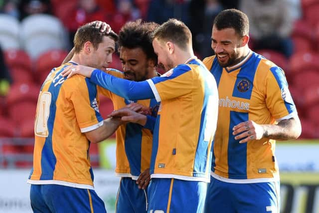 Shrewsbury's players celebrate Shaun Whalley's goal