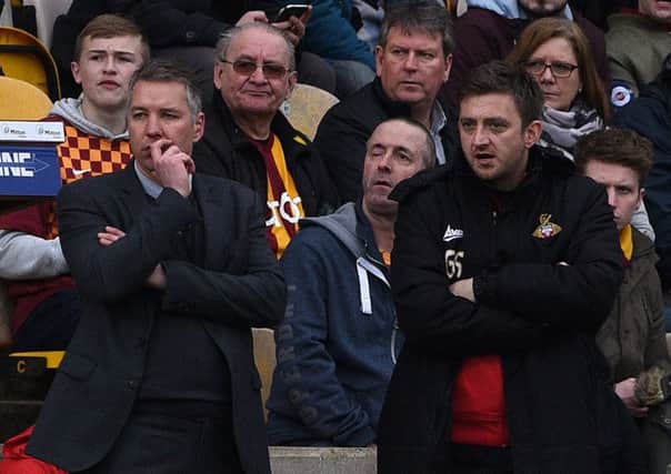 Darren Ferguson and Gavin Strachan watch on at Bradford.