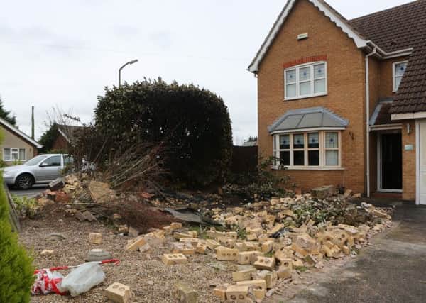 Picture shows the damage left to a house at Poppyfields Way in Branton, near Doncaster in South Yorkshire, after a vehicle crashed into it and burst into flames.