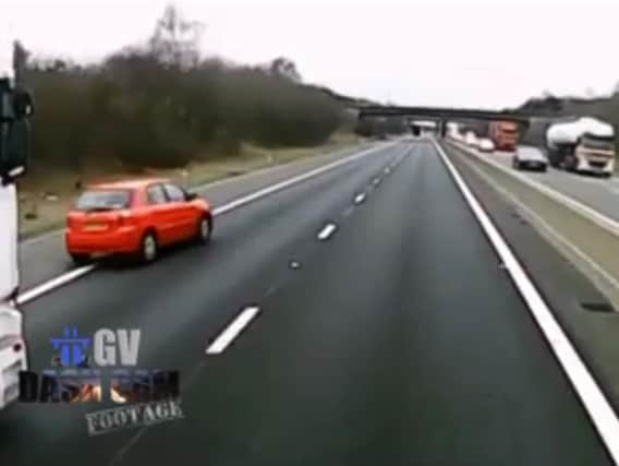 A motorist has captured the shocking moment a car narrowly avoided causing a collision, after he attempted to dangerously overtake a lorry by driving on the slip road of a Doncaster motorway.