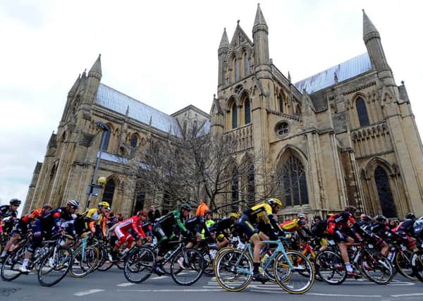 James Hardisty, Stage 2 of The Tour De Yorkshire from Selby to York, 174KM, Riders in the main peloton pass Beverley Minster.